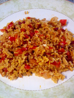 Una foto de Arroz a la milanesa con pimiento y jamón