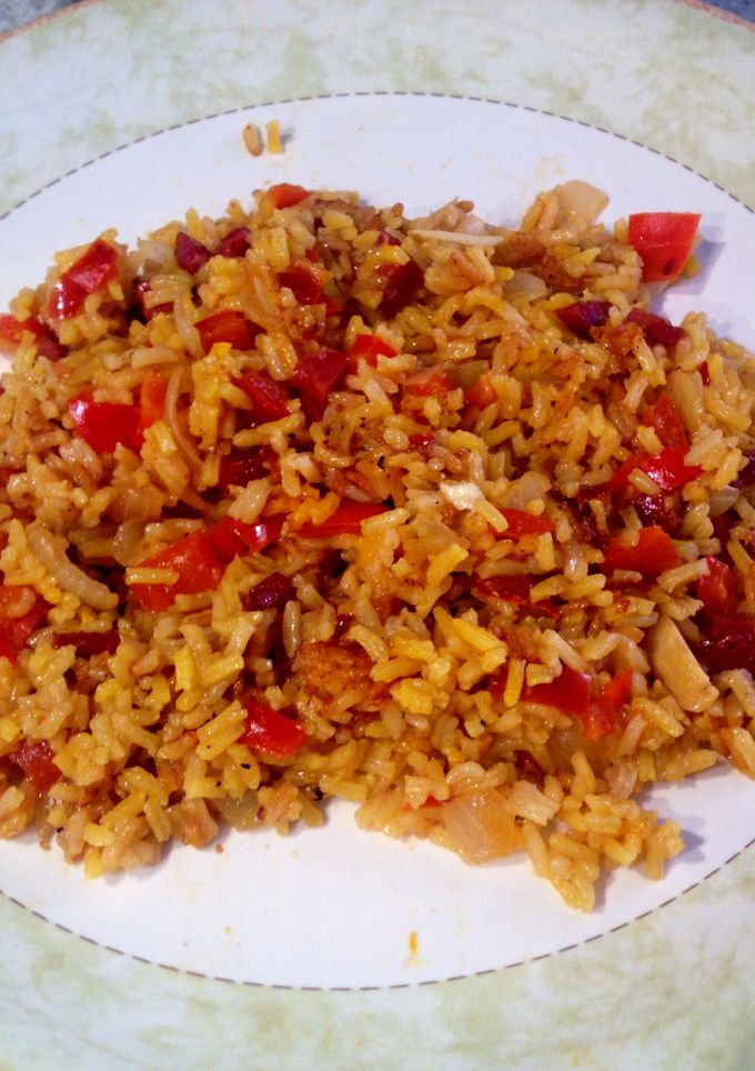 Una foto de Arroz a la milanesa con pimiento y jamón
