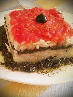 Una foto de Tartar de esqueixada con bacalao y olivada