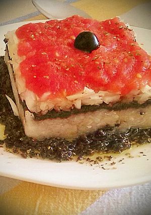 Una foto de Tartar de esqueixada con bacalao y olivada
