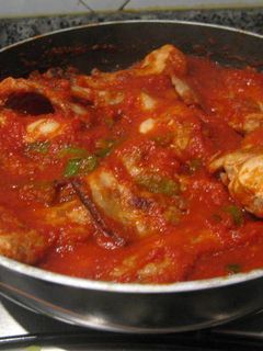 Una foto de Conejo frito con tomate y pimientos de Murcia