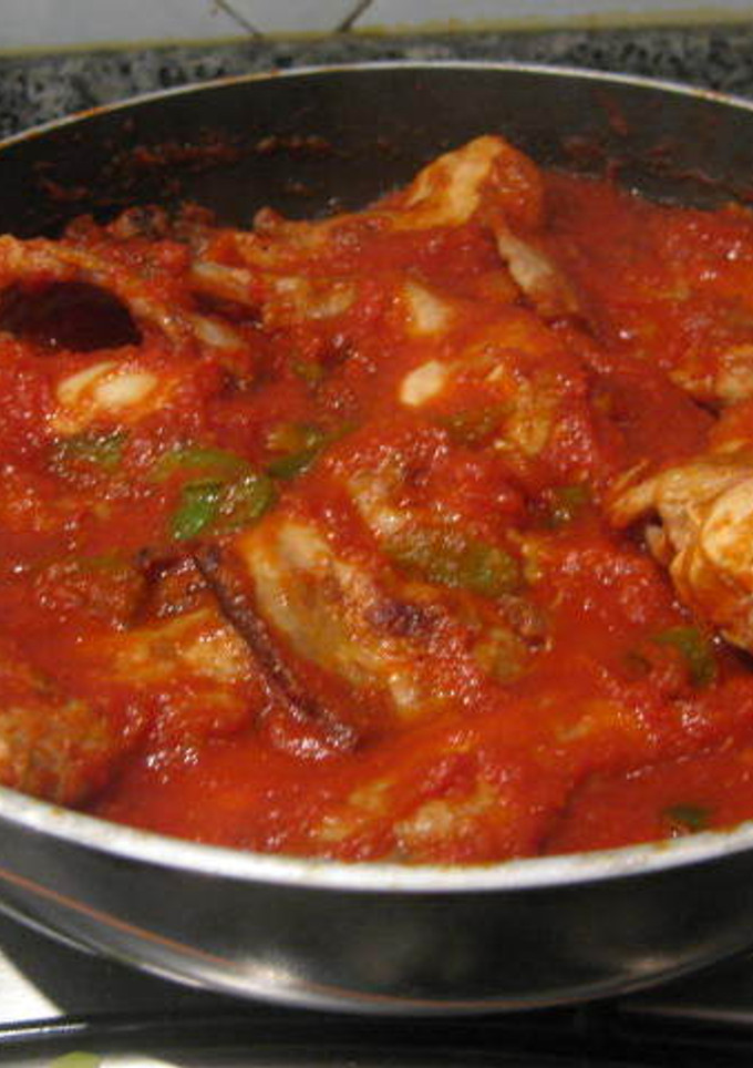 Una foto de Conejo frito con tomate y pimientos de Murcia