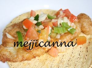 Una foto de Tacos de pescado con cerveza