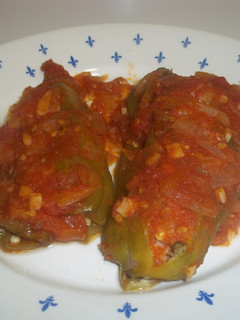 A picture of Long Green Peppers Stuffed with Meat and Sauce.