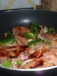Una foto de Chuletas de paleta de cerdo en el wok