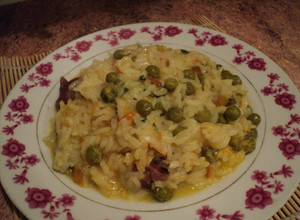 Una foto de Arroz cremoso con verduras en caldo de pollo