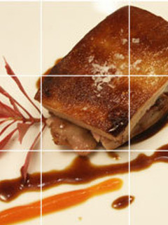 Una foto de Cochinillo confitado