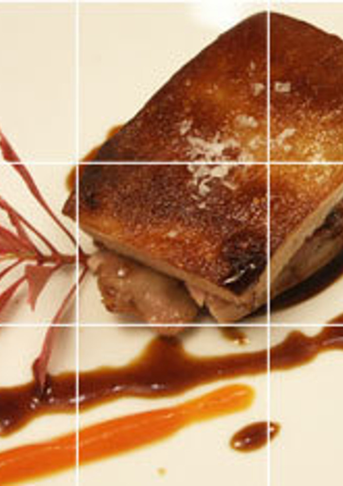 Una foto de Cochinillo confitado