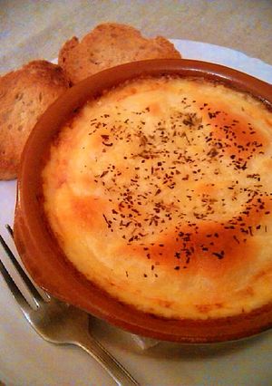 Una foto de Provolone con salsa boloñesa