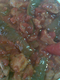 Una foto de Magra de cerdo frita con pimientos y tomates