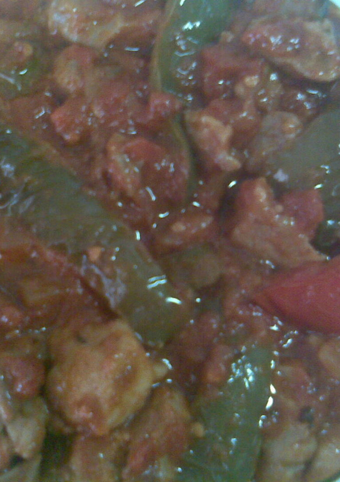 Una foto de Magra de cerdo frita con pimientos y tomates