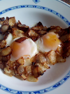 Una foto de Huevos fritos con cebollas