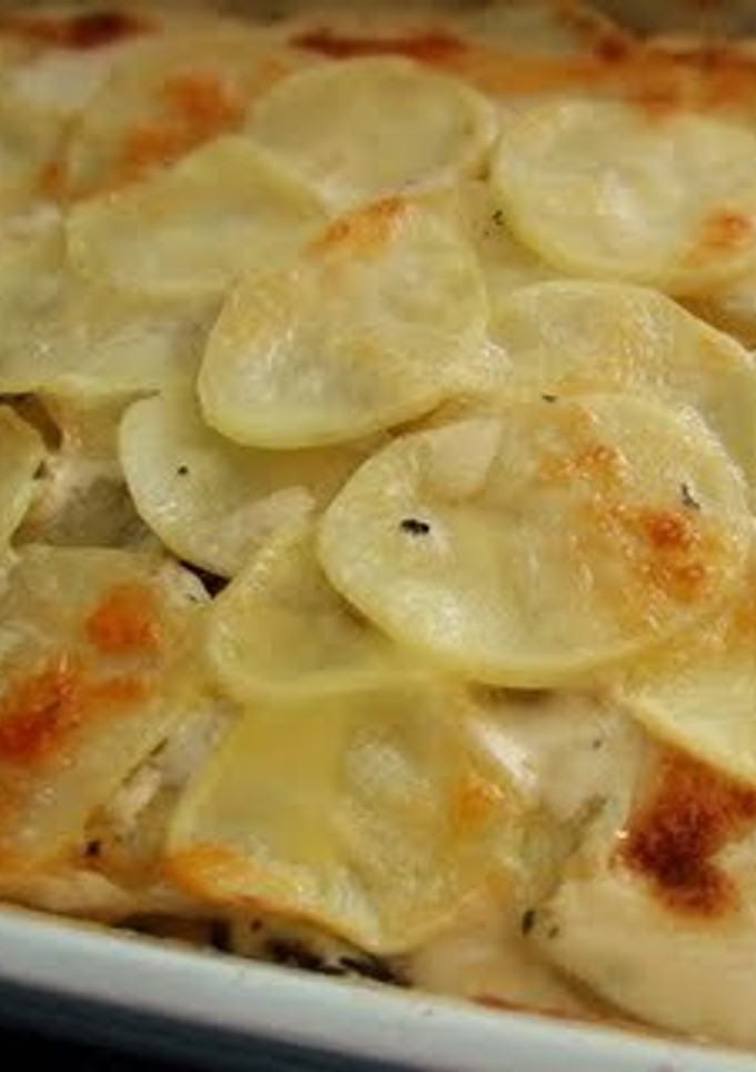Una foto de Papas al gratín con champiñones
