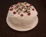 A picture of step 32 of White Layer Cake with a Raspberry Swirl Cheesecake center layer and a Raspberry Cream Frosting.