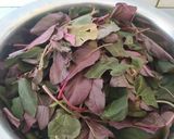 A picture of step 1 of Amaranth garlic fry.