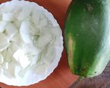 A picture of step 1 of Raw papaya sabzi🧄🧅🍅🌶️.