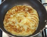 A picture of step 5 of Pommes Anna.
