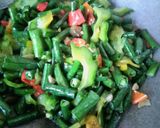 Foto langkah ke 5 dari resep Tumis pare kacang panjang.