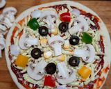 A picture of step 1 of Mushroom pizza.
