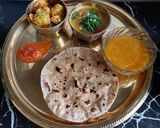 A picture of step 4 of Sukhi Bhaaji Khati meethi dal and fulka roti - a Gujarati Thali.