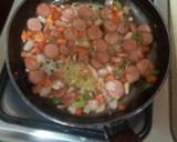 A picture of step 3 of Sausage Noodles with fried egg.