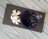 A picture of step 2 of Purple yam kheer with Butterfly pea flower.