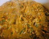 A picture of step 5 of Roasted tomatoes stew garnished with fish sauce.