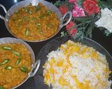 A picture of step 8 of Dam allu with colourful zeera rice.