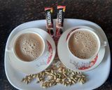 A picture of step 3 of Hot Cardamom coffee.