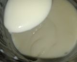 A picture of step 9 of Vanilla cream filled doughnuts.