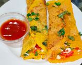 A picture of step 4 of Besan chilla with stuffing.