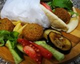 A picture of step 7 of Falafel sandwich||Falafel wrap.