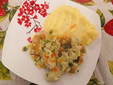 Pollo arvejado en crema blanca