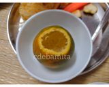 A picture of step 1 of Orange Kulfi in orange shell.