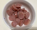 A picture of step 3 of Cabbage and Onion Sausage Fried Rice.