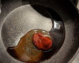 A picture of step 7 of Crispy Fried Gochujang Enoki Mushrooms.
