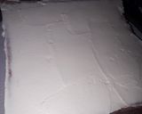 A picture of step 11 of Strawberry milk cake with whipped cream frosting.