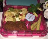 A picture of step 1 of Nachos, crumbed chicken pieces, mini corn cobs, pineapple grape and mint fruit skewer.