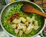 A picture of step 2 of Cowpea Beans Hari Pyaaz and Aloo Methi.