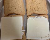 A picture of step 2 of Chilli Cheese Toast on tawa.