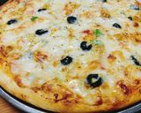 A picture of step 4 of Chicken Tikka Pizza 🍕🍕.