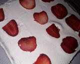 A picture of step 11 of Strawberry milk cake with whipped cream frosting.