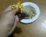 A picture of step 4 of MODAK WITH BANANA & PEANUT DIPPED IN CHOCOlATE.