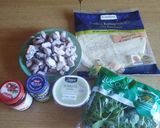A picture of step 1 of Piadina with Octopus, Burrata, Pesto, Sun-Dried Tomatoes & Arugula.