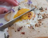 A picture of step 7 of Savoury Rosemary Flower Egg in a Hole.