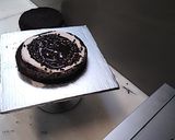 A picture of step 1 of 8 inch tall chocolate brownie cake.