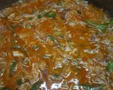 A picture of step 2 of Spanish chicken with browned rice.