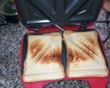 A picture of step 5 of Toasted Bread with Fried Eggs and Baked Beans.
