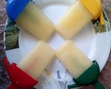 A picture of step 5 of Pineapple Popsicles.