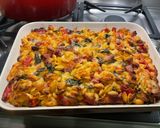 Une image de l'étape 14 de Gratin de gnochettis aux épinards, lard et tomates.